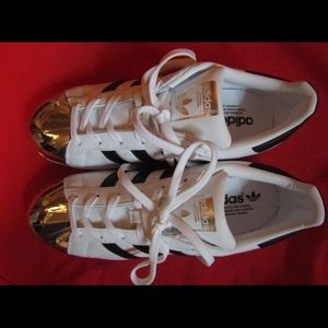 White Adidas Superstars with silver metal toe